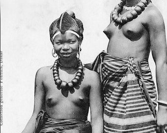 Reprinted Black & White Postcard Photograph of Two Topless African Women of Dakar. An Ethnic Photo Circa 1910s