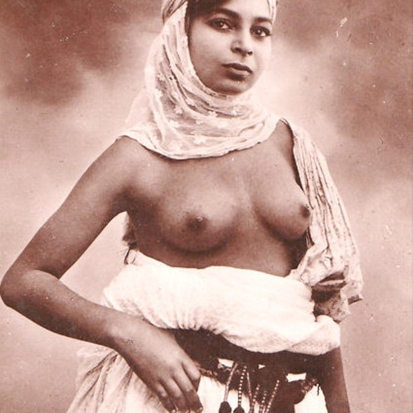 Reprinted Old Postcard Photograph of Topless North African Woman. An Ethnic Photo Circa 1910s