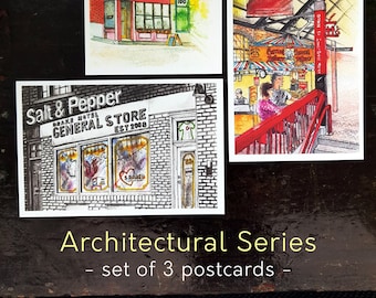 Könnte beinhalten: Ein Set aus drei Aquarell-Postkarten mit architektonischen Details von Gebäuden. Die erste Postkarte zeigt ein rotes Backsteingebäude mit einem Ladenlokal, das mit "MIDI 168" beschriftet ist. Die zweite Postkarte zeigt eine farbenfrohe Marktszene mit einem Schild, auf dem "Down to the Market" steht. Die dritte Postkarte zeigt eine Schwarzweißillustration eines Ladenlokals mit der Aufschrift "Salt & Pepper Brake Hotel General Store Est 2008".