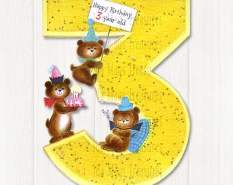May include: A large yellow number three cutout decorated with three brown teddy bears. One bear wears a blue party hat and holds a sign reading Happy Birthday 3 year old. Another bear wears a pink hat and holds a cake. A third bear sleeps on a blue pillow.