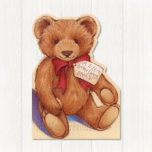 May include: A brown teddy bear illustration with a red bow and a tag that reads "A little Something Special...". The bear is sitting down with its arms and legs outstretched. The background is a light beige color.