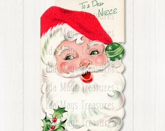 May include: A vintage-style greeting card featuring a detailed illustration of Santa Claus with a red hat, white beard, and rosy cheeks. The card includes a green ornament, holly leaves with red berries, and the text To a Dear Niece in green.