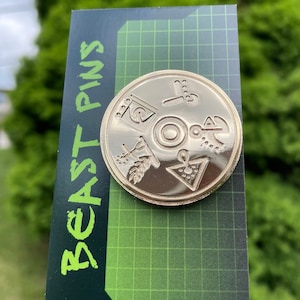 Vok Golden Disk Pin