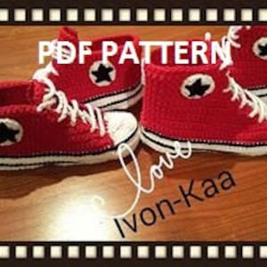 May include: A pair of red crocheted high-top sneakers with white trim and black star accents. The sneakers are on a wooden surface. PDF PATTERN.