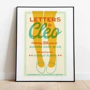 May include: A vintage-style concert poster with a yellow and green color scheme. The poster advertises a concert for Letters to Cleo, celebrating 30 years of Aurora Gory Alice with special guests Gigolo Aunts. The concert is scheduled for November 10th at The Paradise in Boston.