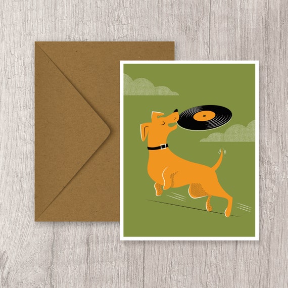 Dog playing frisbee with vinyl record