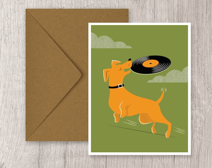 Dog playing frisbee with vinyl record