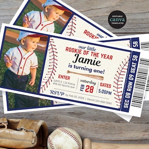 May include: Baseball-themed birthday party invitations featuring a photo of a baby in a baseball uniform. The invitations are designed to look like baseball tickets, with text that reads "Rookie of the Year" and the child's name. The date and time are also included.