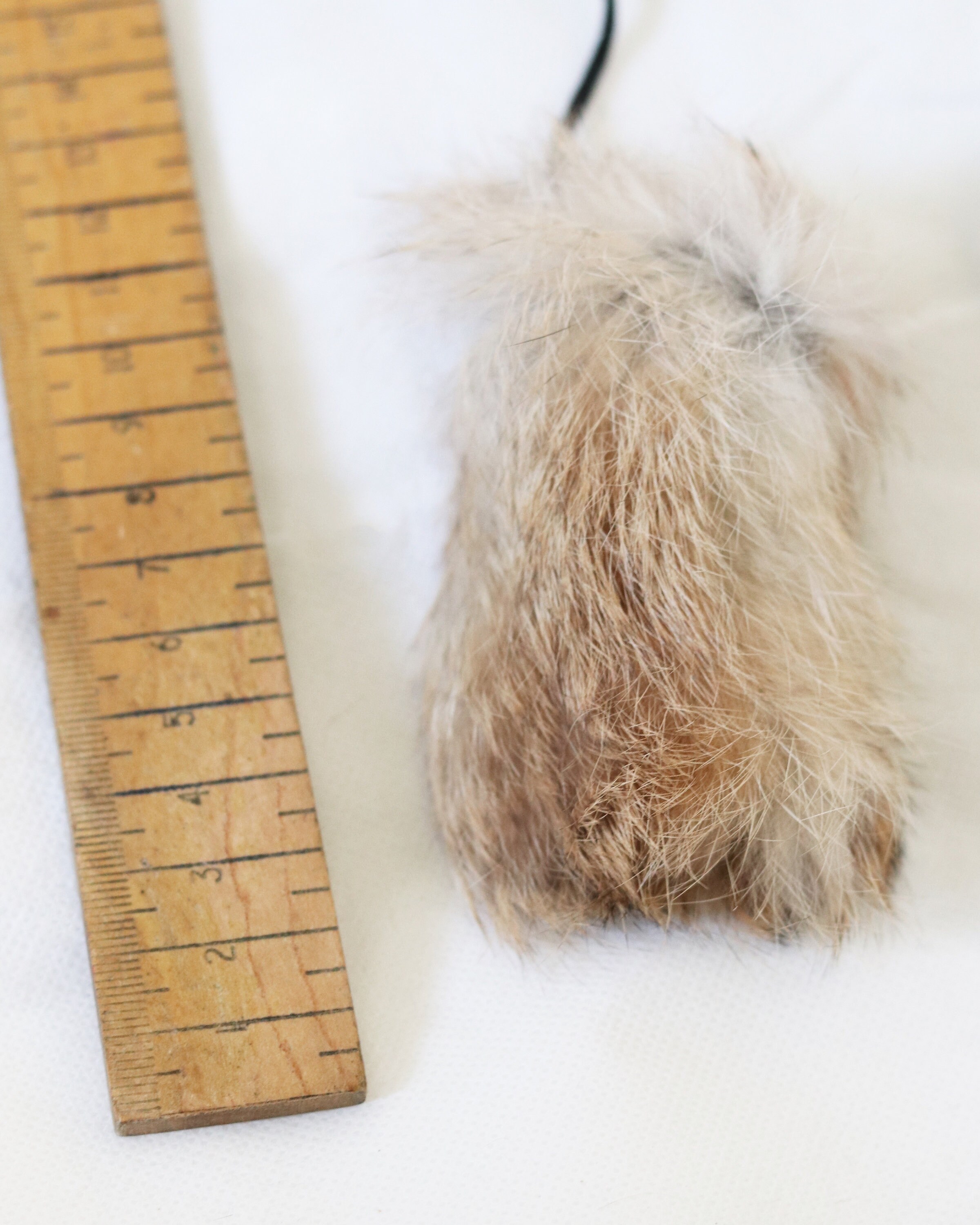 Rabbit Fur chirp toy on a long string