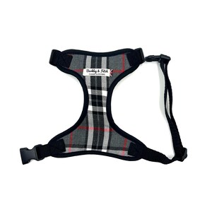 May include: Black and grey plaid dog harness with a black lead and a label that reads "Barkley & Fitch, Canine Outfitters".