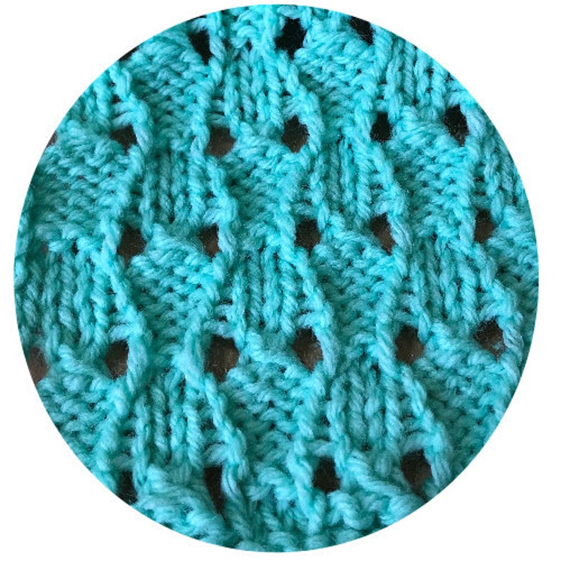 May include: A close-up of a teal blue knitted fabric with a repeating pattern of woven stitches creating a textured surface.