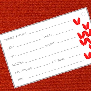 May include: A white card with black lines and text for recording knitting project details. The text includes "Project/Pattern", "Loom", "Yarn", "Stitches", "# of Stitches", "Size", "Gauge", "Weight", and "# of Rows". A red knit stitch pattern is shown in the upper right corner.