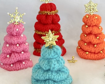 May include: Four crocheted Christmas trees in pink, red, orange, and blue. Each tree is decorated with gold stars and beads.