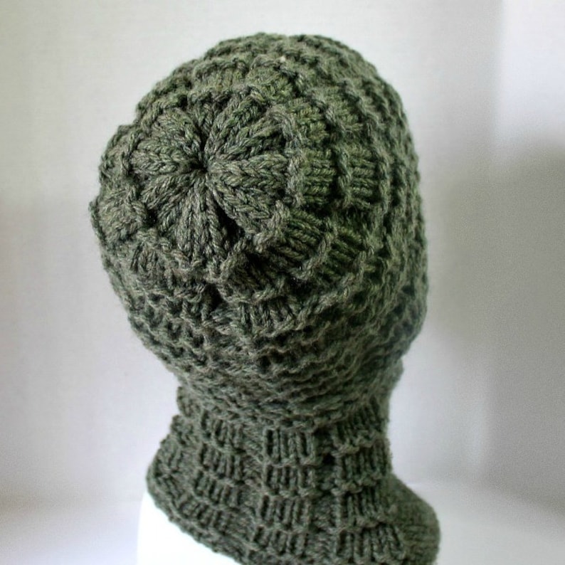 May include: A green knitted hat with a unique textured pattern. The hat has a folded brim and a slouchy fit.