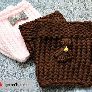 May include: Two knitted cup cozies, one pink and one brown. The pink cozy has a silver bow with rhinestones. The brown cozy has a brown tassel with a gold bead.