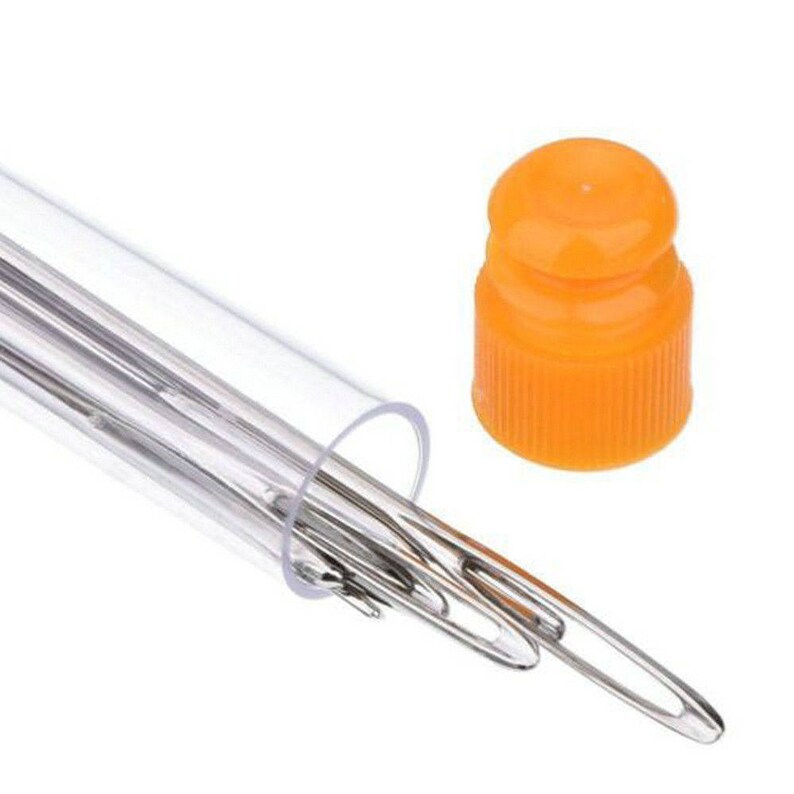 May include: A set of clear plastic needles with an orange plastic cap. The needles are stored in a clear plastic tube.