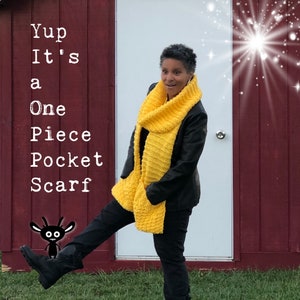 May include: A person wearing a yellow knitted scarf with a pocket. The scarf is a single piece of fabric. The text "Yup It's a One Piece Pocket Scarf" is visible in the image.