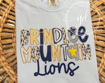 Brindlee Mountain Lions  school spirit shirts, Arab Alabama game day shirt, navy gold lions trendy preppy style school spirit wear shirt