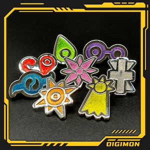 May include: A collection of Digimon enamel pins in various shapes and colors, including red, blue, green, purple, pink, yellow, and silver. Each pin features a unique design with a silver outline. The word "DIGIMON" is visible in the bottom right corner.