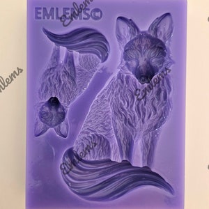May include: Purple silicone mould with three fox designs. The mould features a full-body fox, a fox head, and a fox tail. The mould is labelled "EMLENSCO EMBLEMS".