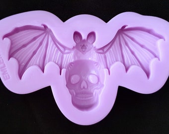 Emlems New Bat holding Skull Silicone Mould for resin, chocolate, clay, wax, concrete, plaster and more