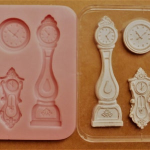 Può includere: Uno stampo in silicone con otto diversi disegni, tra cui un orologio, una donna e una maschera. Lo stampo è rosa e ha una superficie liscia.