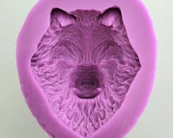 May include: Purple silicone mould for making resin crafts. The mould is shaped like a wolf's head with detailed fur texture.