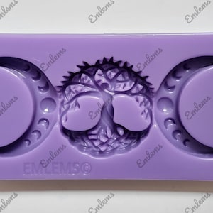 May include: Purple silicone mold with two crescent moon shapes and a tree of life design in the center. The mold is labeled "EMLEMSO".