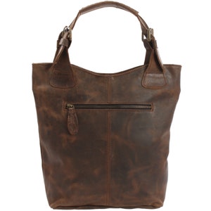 May include: A brown leather tote bag with a zippered pocket on the front. The bag has two top handles with metal buckles.
