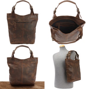 May include: A brown leather tote bag with a zippered pocket and adjustable straps. The bag is shown from different angles, including a view of the inside.