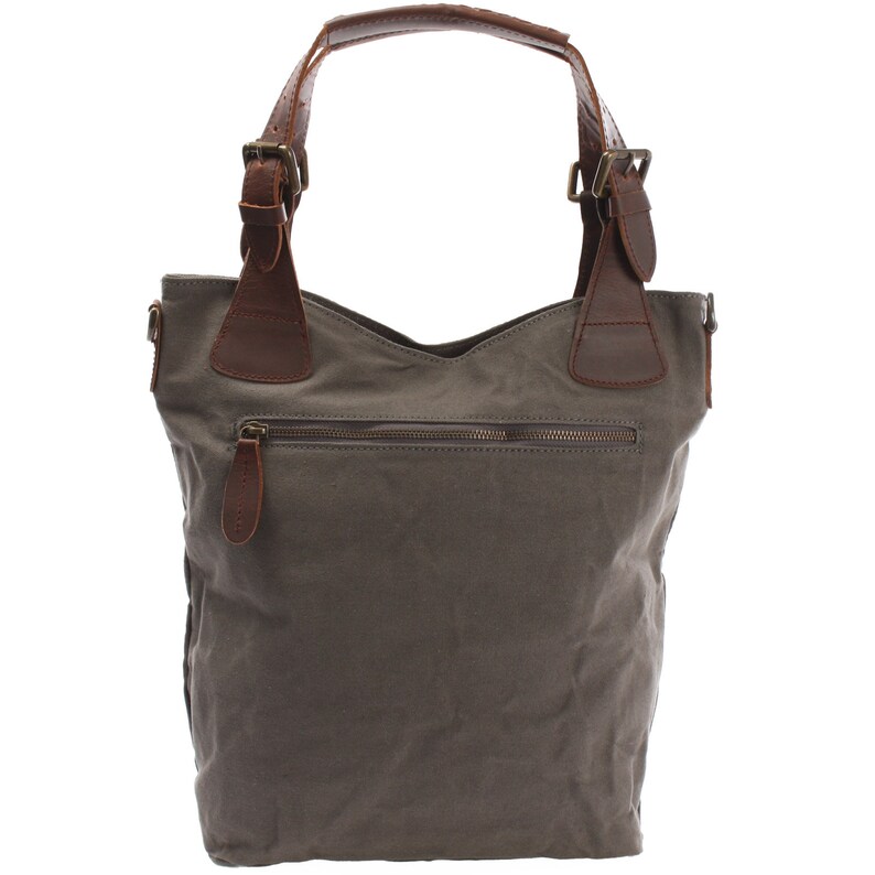 May include: A gray canvas tote bag with brown leather handles and buckles. The bag has a zippered pocket on the front.