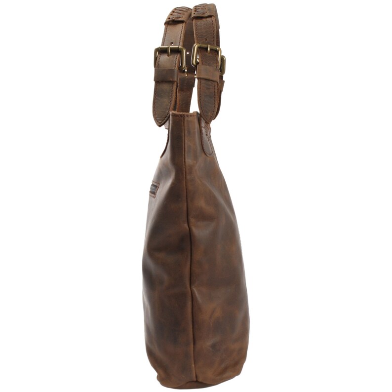 May include: A brown leather tote bag with double straps and buckles. The bag has a distressed look and is made of high-quality leather.