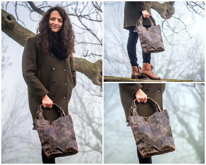 May include: A brown leather tote bag with a distressed finish. The bag has two top handles and a zipper closure.