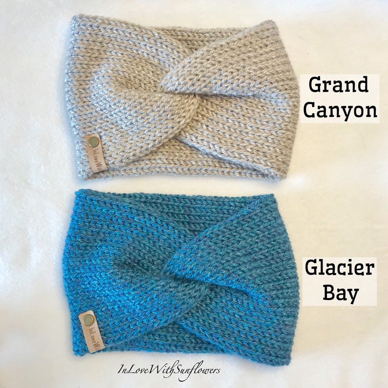 May include: Two knitted headbands in a twisted style. The top headband is a light beige color and says "In Love With" on the label. The bottom headband is a teal blue color and says "In Love With" on the label. The text "Grand Canyon" is written in black above the top headband and the text "Glacier Bay" is written in black above the bottom headband.