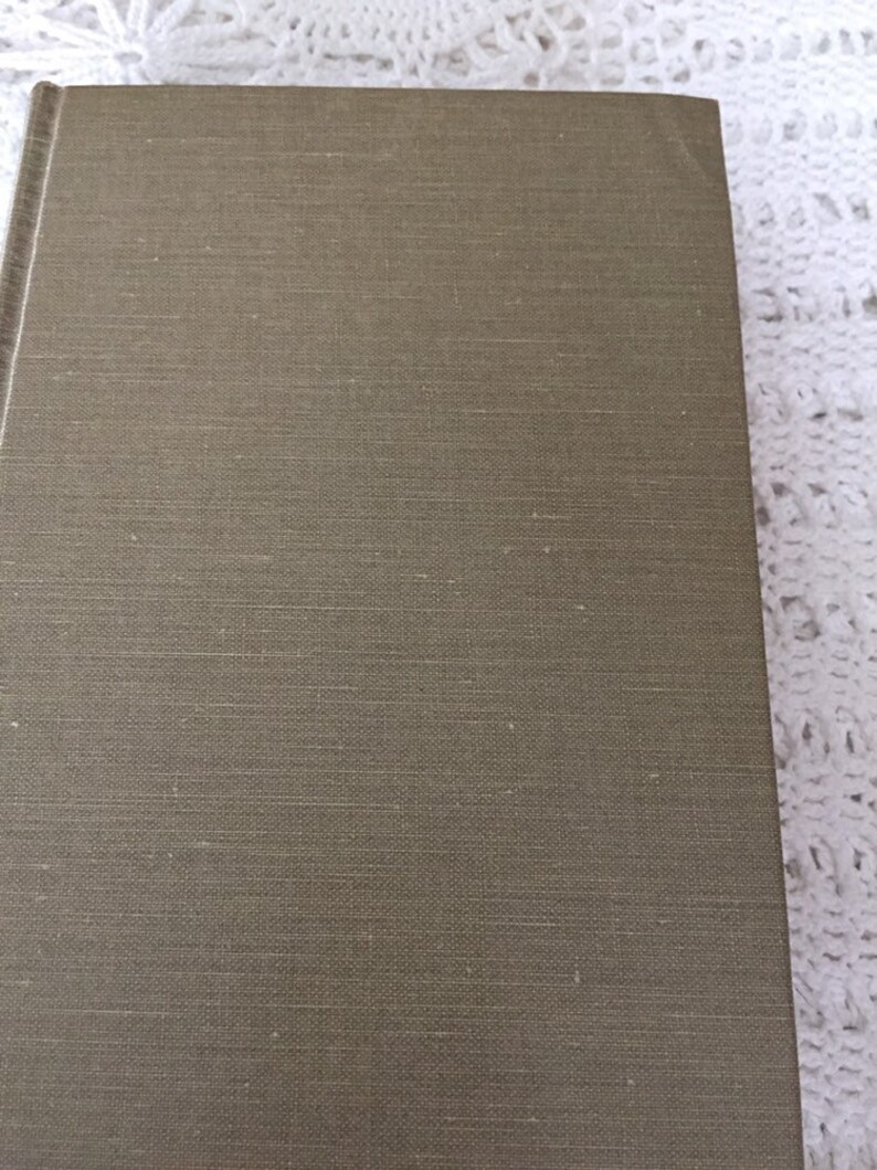 May include: A brown linen-textured book cover.