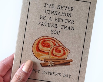 May include: A brown card with the text "I've never cinnamon be a better father than you" and a drawing of two cinnamon rolls and cinnamon sticks. The card also says "Happy Father's Day".