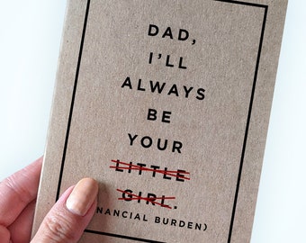 May include: A brown card with black text that reads "Dad, I'll always be your little girl." The words "little girl" are crossed out with red lines and the text "financial burden" is written below.