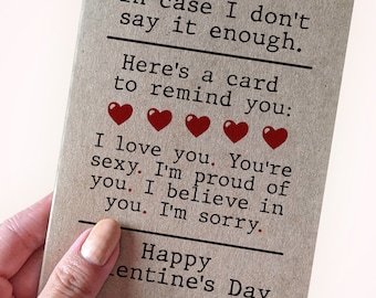 May include: A brown card with the text "In case I don't say it enough. Here's a card to remind you: I love you. You're sexy. I'm proud of you. I believe in you. I'm sorry. Happy Valentine's Day" and five red hearts.