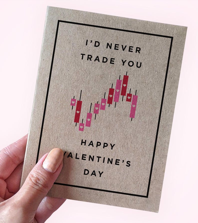 May include: A brown card with a black border and the text "I'd never trade you" in black font. A red and pink candlestick chart with small pink hearts is below the text. The text "Happy Valentine's Day" is below the chart.