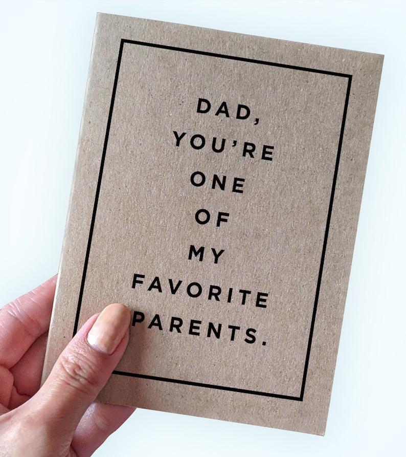 May include: A brown card with black text that reads "Dad, you're one of my favourite parents."
