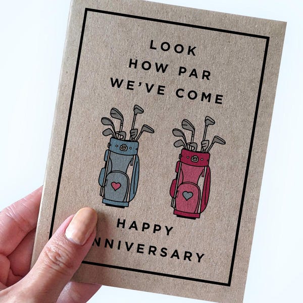 May include: A brown card with the text "Look how par we've come" and two cartoon golf bags with clubs and hearts. The text "Happy Anniversary" is below the bags.