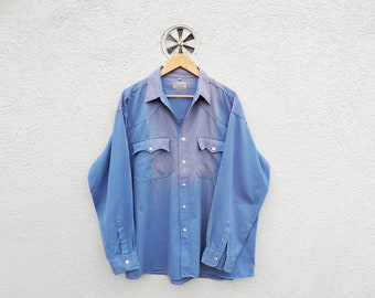 Blauw vintage jaren 80 werkkleding herenshirt met button-downkraag | Workertop van distressed denim | Stoere industriële mode