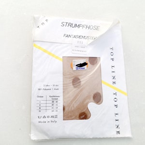 May include: A packet of brown patterned tights with a white label that reads "Strumpfhose Fantasiemuster III 42-44 Dirpent" and "Top Line Top Line". The label also includes a size chart and washing instructions.