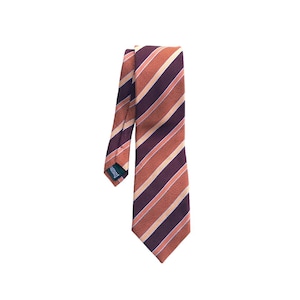 May include: A striped tie with orange, beige, and purple stripes. The tie is made of a silky material.
