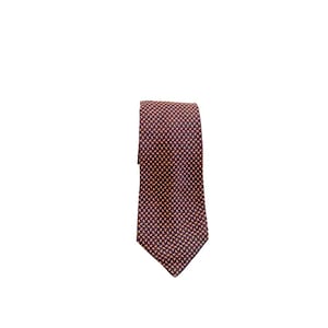 May include: A patterned tie with a repeating design in shades of burgundy and orange. The tie is displayed against a white background, showcasing its intricate pattern and color contrast. This accessory is suitable for formal or business attire.