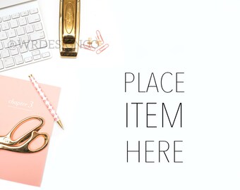 May include: A white keyboard, a gold stapler, pink paper clips, a pink notebook labeled chapter 3, a pink and white patterned pen, and gold scissors. The text PLACE ITEM HERE is printed in black on the right side of the white background.