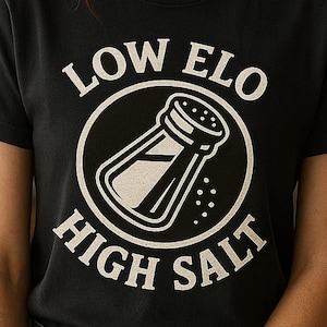 May include: A black t-shirt with a white graphic of a salt shaker and the text "LOW ELO HIGH SALT".