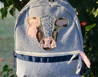 Southern Chic Cow Applique Seersucker Bookbag, seersucker, cow applique, plaid, cow tags, applique, dash forward