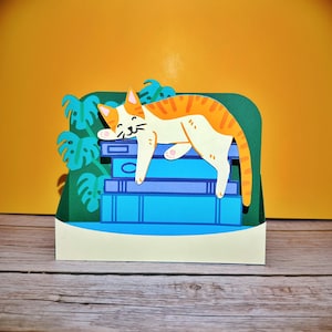 Carte pop-up Chat sur une commode