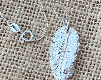 Pure solid silver large feather pendant.including sturdy sterling silver chain.